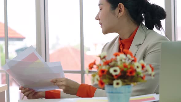 Two Business People Talk Project Strategy at Office