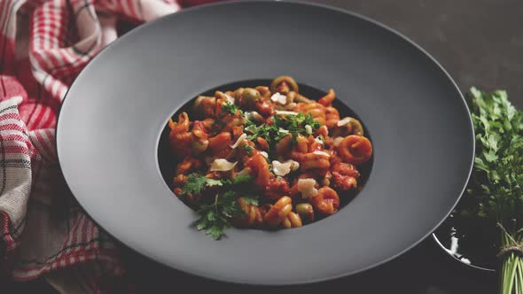 Tasty Appetizing Classic Italian Pasta with Tomato Sauce Cheese Parmesan and Basil on Plate