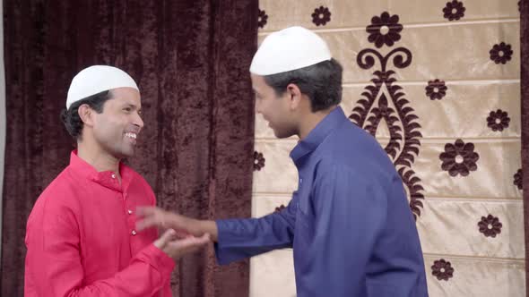 Muslim man congratulating his friend