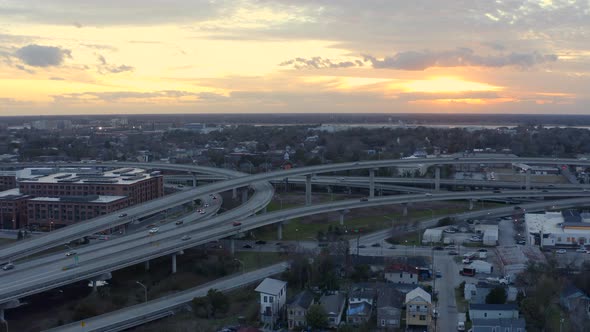 Pulling away from criss-crossing highways at sunset