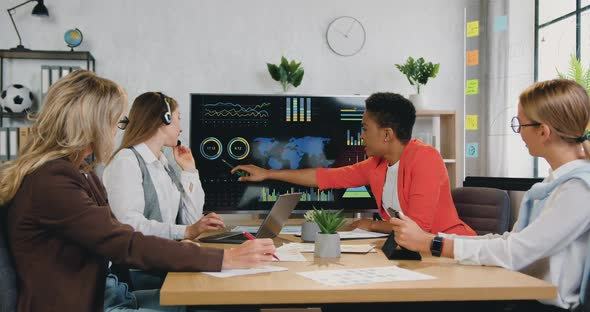 Businesswoman Explaining Presentation on Digital Screen for Positive Successful Female Colleagues