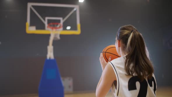 Sporty Lifestyle Basketball Training Game Female Player Successfully Throws a Basketball Into the