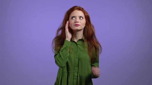 Bored Woman Portrait Her Head is Spinning Around on Violet Background