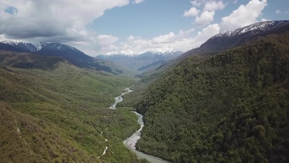 Beautiful River in a Green Forest and Great Valley Top View