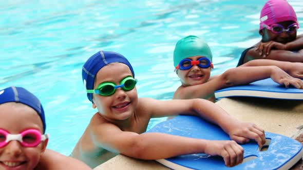 Cute little kids in the swimming pool