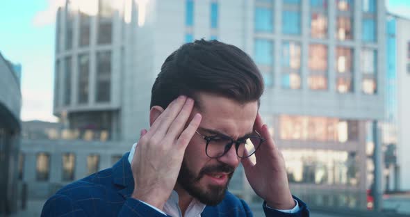 Young Handsome Man Having Headache