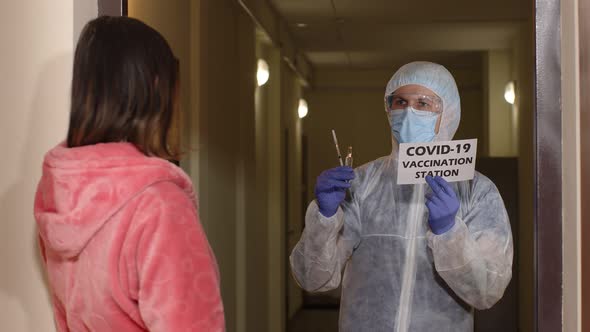 Doctor with Inscription Text Visiting Woman Patient at Home Offering Vaccination Against Coronavirus