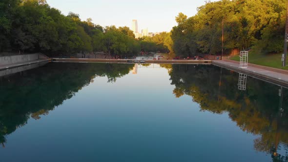 Straight shot of barton springs pool over to barking springs spillway towards downtown Austin Texas.