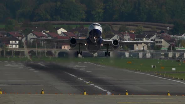 Modern Airplane Airliner Taking Off at Airport Runway