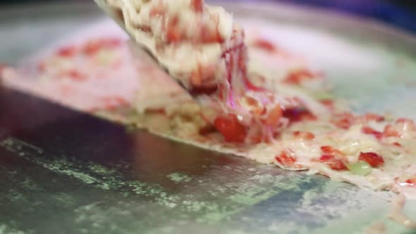 Close Up of Palette-knife Mixing Berries with Cream and Biscuits on Freezing Pan