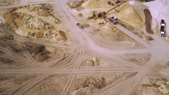 The Truck is Driving Through a Sand Quarry