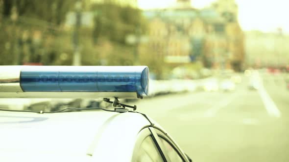 Flashing Flasher on the Roof of a Police Car. Blinker. Close-up.