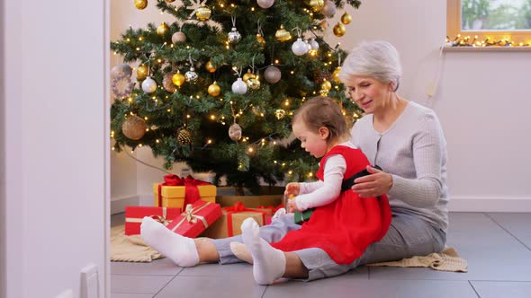 Grandmother and Baby Girl with Christmas Gifts