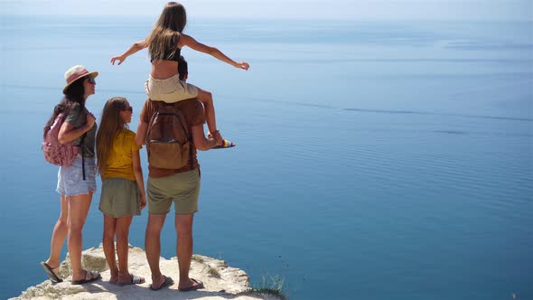 Happy Family on Vacation in the Mountains