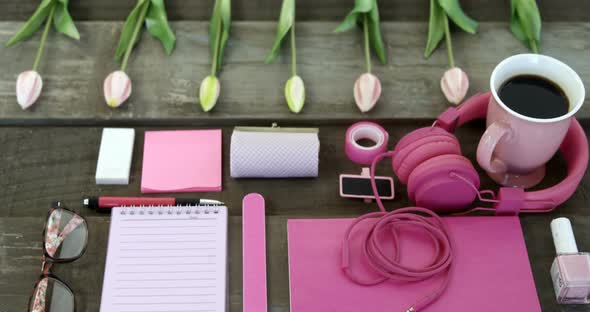 Female accessories, stationery and coffee on table