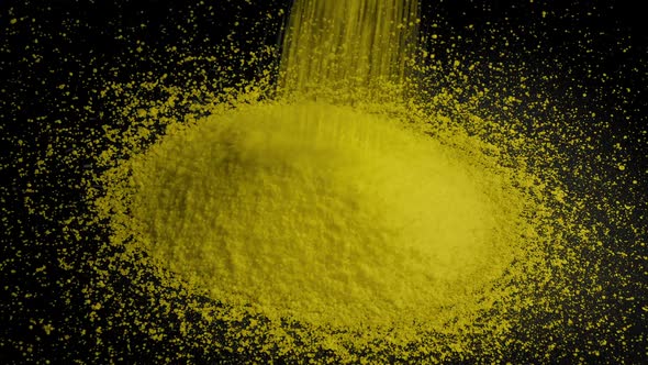 Yellow Granules Pour Into Pile