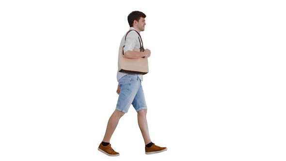 Handsome Smiling Man in White Shirt Walking with a Bag on His Shoulder on White Background