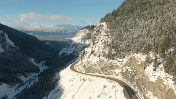 Aerial Drone View of a Scenic Highway in the Valley Between Canadian Mountain Landscape