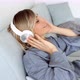 Portrait of cheerful european woman in headphones listening to music - VideoHive Item for Sale