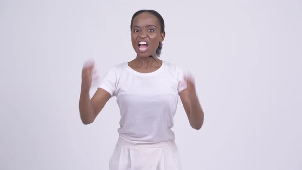 Young Angry African Woman Talking Aggressively and Shouting