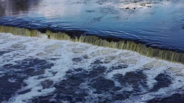 Flying Fish at Ventas Rumba The Widest Waterfall in Europe in Latvia Kuldiga, Aerial Dron Shot