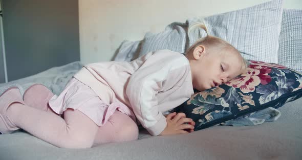 Cute Toddler Girl is Sleeping in Living Room at the Day