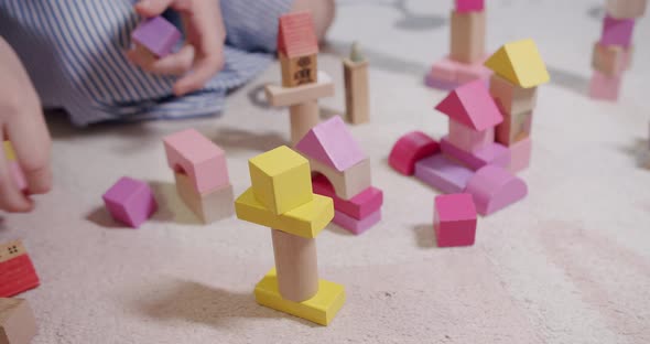 Children Play with Toys Sit on Floor Carpet at Home