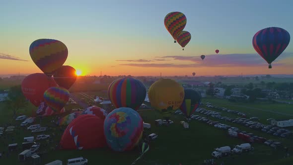 Aerial View of a Morning Launch of Hot Air Balloons at a Hot Air Balloon Festival at Sunrise