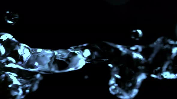 Super Slow Motion Shot of Flowing Water at 1000Fps Isolated on Black Background