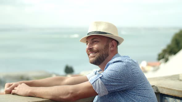 Slow Motion of Happy Man Sitting on Observation Tower