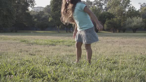 Cropped View of Long-haired Latin Girls Kicking Ball