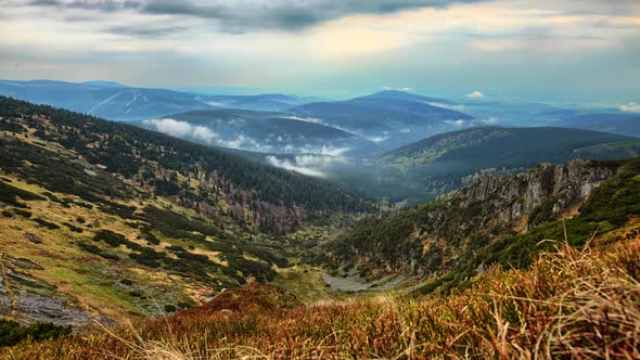 Beautiful distant view of the fog coming out of the forest. Czech republic, time lapse