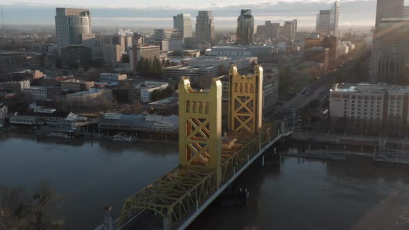 Aerial drone left parallax of Tower Bridge and Downtown Sacramento, CA, including Old Sacramento & S