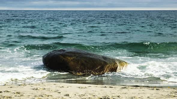 Ocean Waves Splashing On The Rock At Beach. - wide static shot