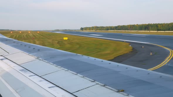 Airplane Taxiing on the Runway Before Takeoff