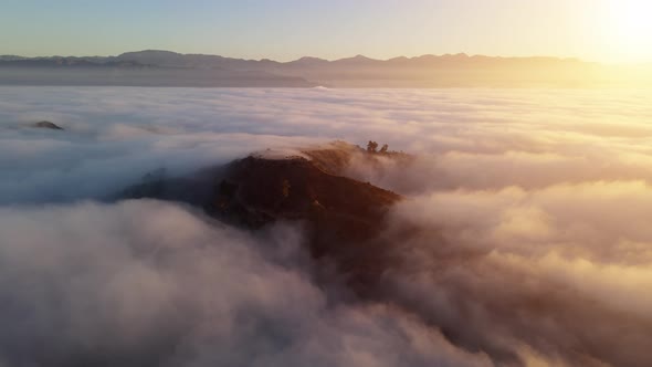 Aerial time lapse of low clouds at dawn