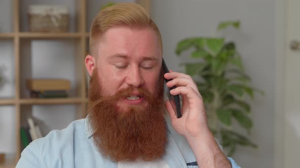 Head Shot Young Redhead Man Involved in Mobile Phone Conversation Sharing Life News Discussing