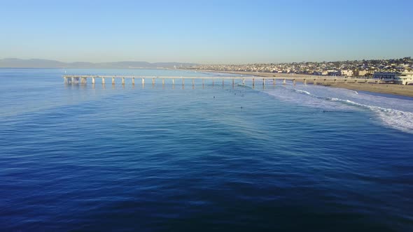 Aerial drone uav view of a pier over the beach and ocean