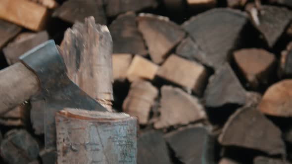 Chopping Wood with an Axe in Woodpile