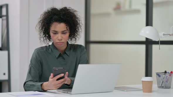 African Woman Laptop Using Smartphone Work