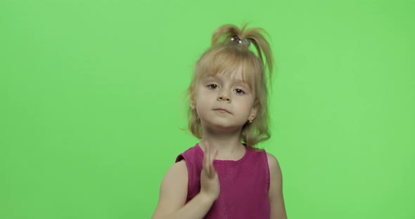 Girl in Purple Dress Dancing and Waving with Hands. Happy Child. Chroma Key