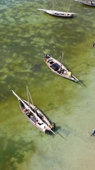 Boat Boats in the Ocean Near the Coast of Zanzibar Tanzania Slow Motion Vertical Video