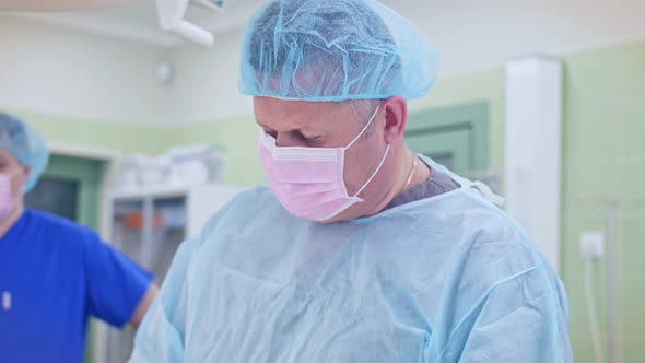 the Surgeon Performs a Surgical Operation