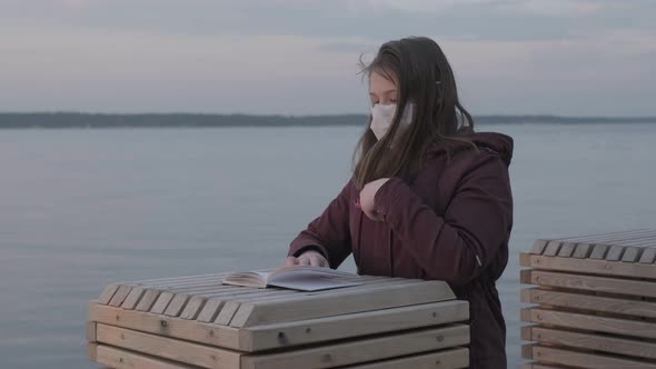 Young Girl in Black Mask Alone Outdoors. Coronavirus Pandemic