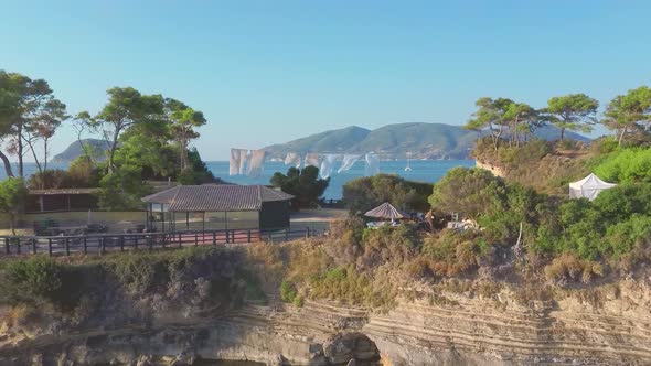 Small tropical island with wooden hanging bridge from Zante Greek island to it.  Aegean sea. Zante Z