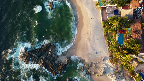 beautiful beachfront resorts in Puerto Vallarta Mexico at sunset, aerial