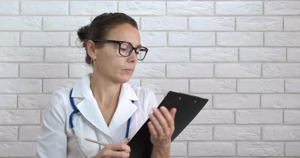 Worried Medical Worker with Papers