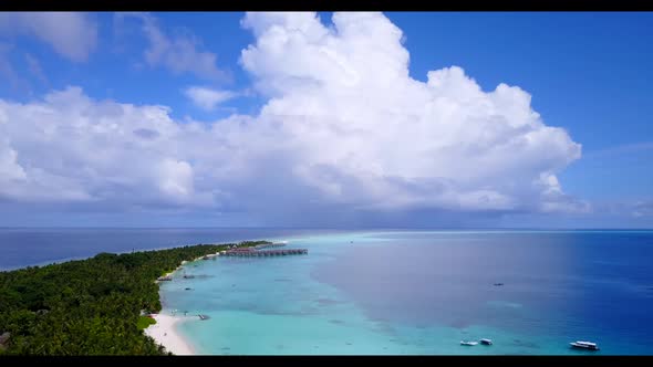 Aerial view abstract of tranquil shore beach vacation by turquoise water with white sandy background