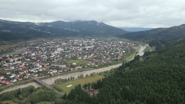 Village in the Carpathian Mountains in Autumn. Slow Motion, Aerial View