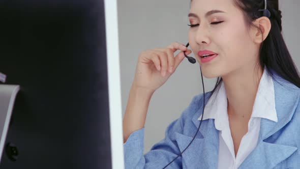 Customer Support Agent or Call Center with Headset Talking to Customer on Phone